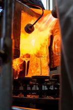 Load image into Gallery viewer, Amphitrite wine glasses in a furnace, undergoing the annealing process of production.
