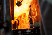 Load image into Gallery viewer, Mouth-Blown Amphitrite wine glasses being crafted in a furnace, showcasing skilled artisan glass-making process.
