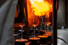 Load image into Gallery viewer, Amphitrite champagne flutes in a furnace, going through the annealing process of the production stage.
